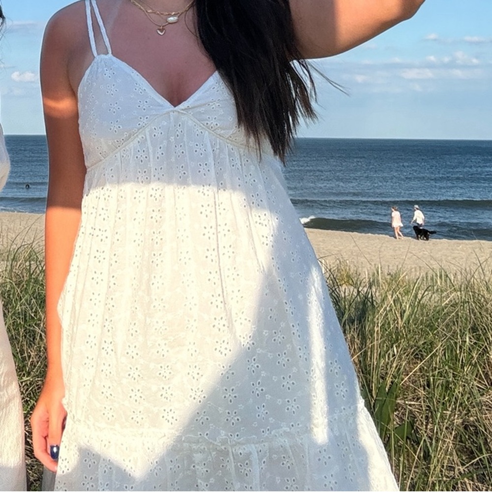 white flowy xs dress with floral detailing throughout